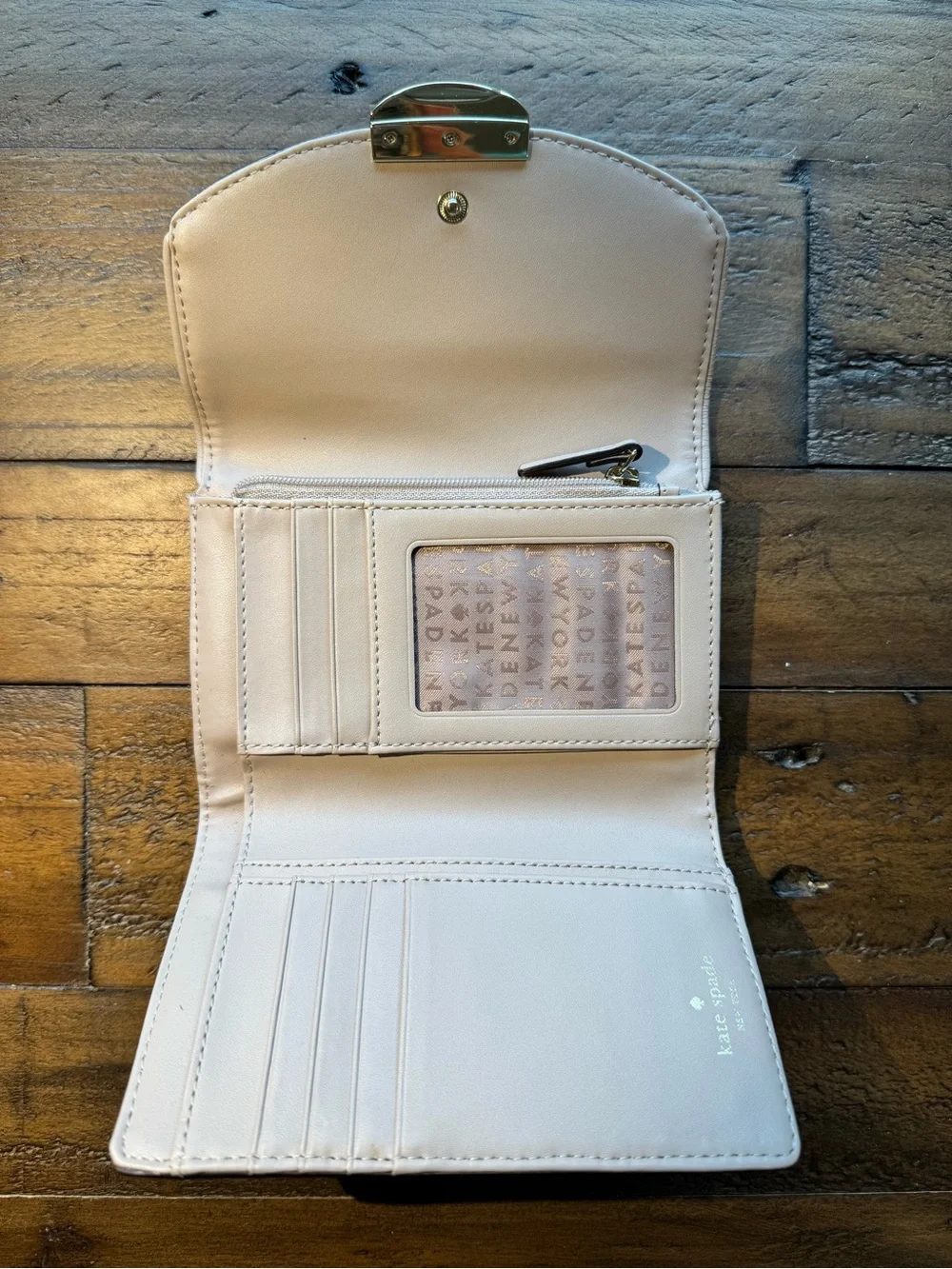 kate spade Cream Pebbled Leather Wristlet with Gold-Tone Plaque